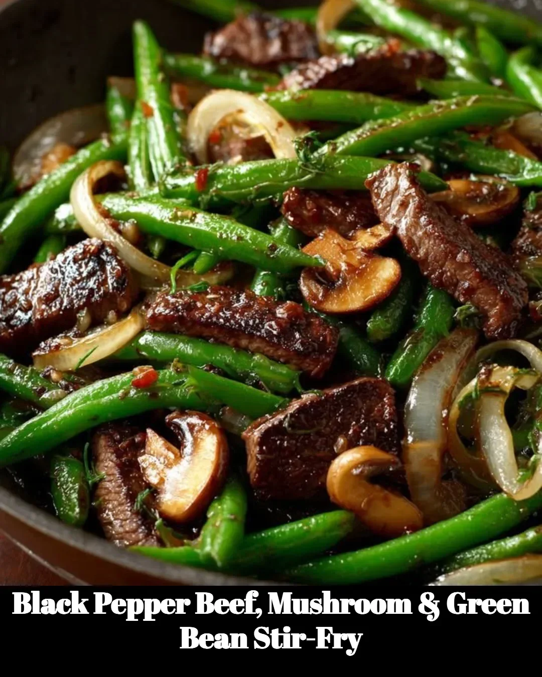 Black Pepper Beef stir-fry with mushrooms and green beans served on a plate