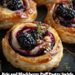 Brie and Blackberry Puff Pastry Swirls garnished with honey and rosemary