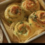 Buttery cheese garlic rolls fresh out of the oven, golden and delicious