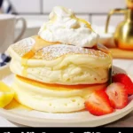 Cloud-like Lemon Soufflé Pancakes topped with fresh lemon zest and berries