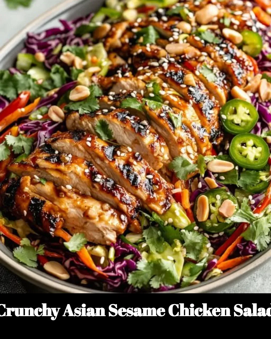 Crunchy Asian Sesame Chicken Salad topped with sesame seeds and fresh veggies