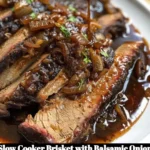 Slow cooker brisket topped with savory balsamic onion gravy