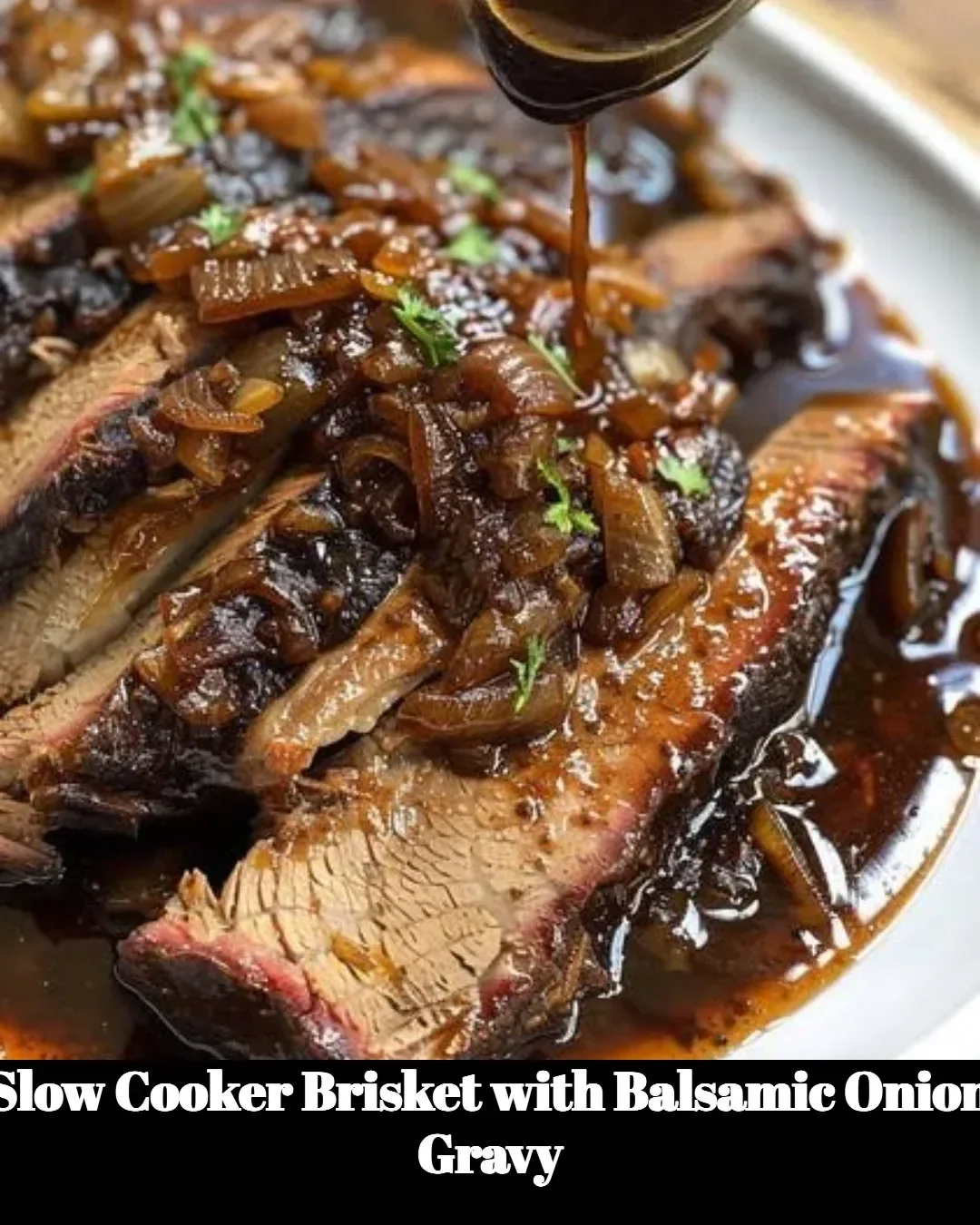 Slow cooker brisket topped with savory balsamic onion gravy
