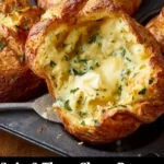 Freshly baked Swiss & Thyme Cheese Popovers served on a plate