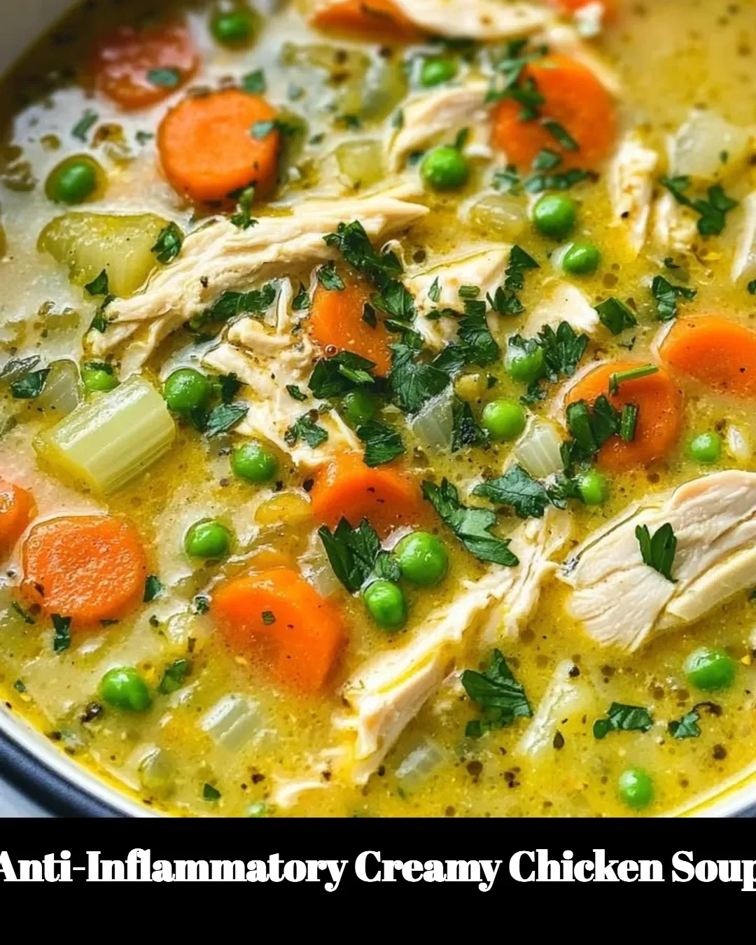 Bowl of anti-inflammatory creamy chicken soup with fresh herbs and vegetables