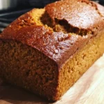 Homemade Applesauce Bread fresh out of the oven, sliced and served on a plate.
