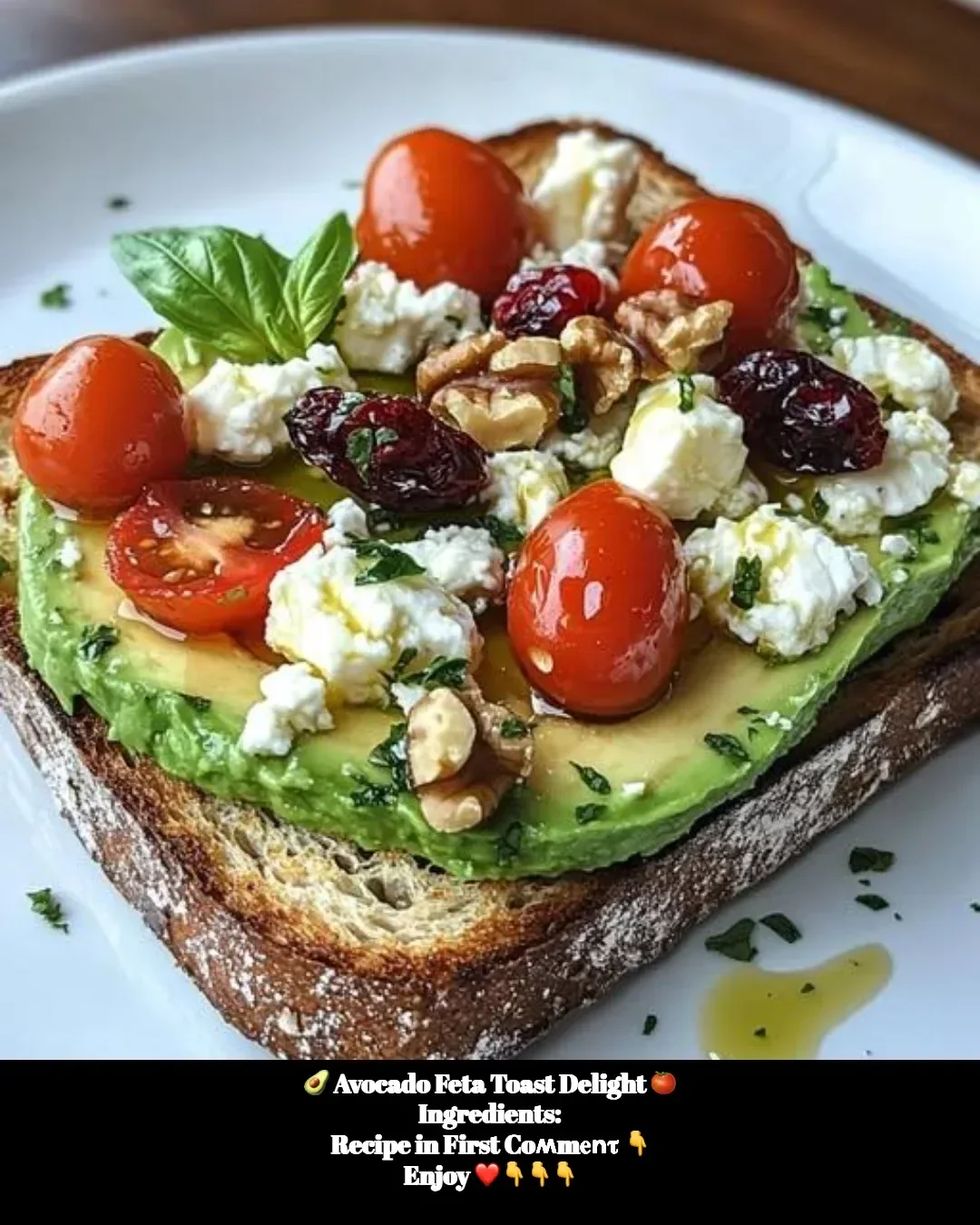 Avocado feta toast topped with fresh herbs and spices for a delicious brunch.