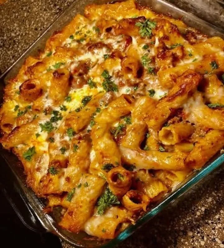 Baked Ziti Bolognese served in a dish, garnished and ready to enjoy.