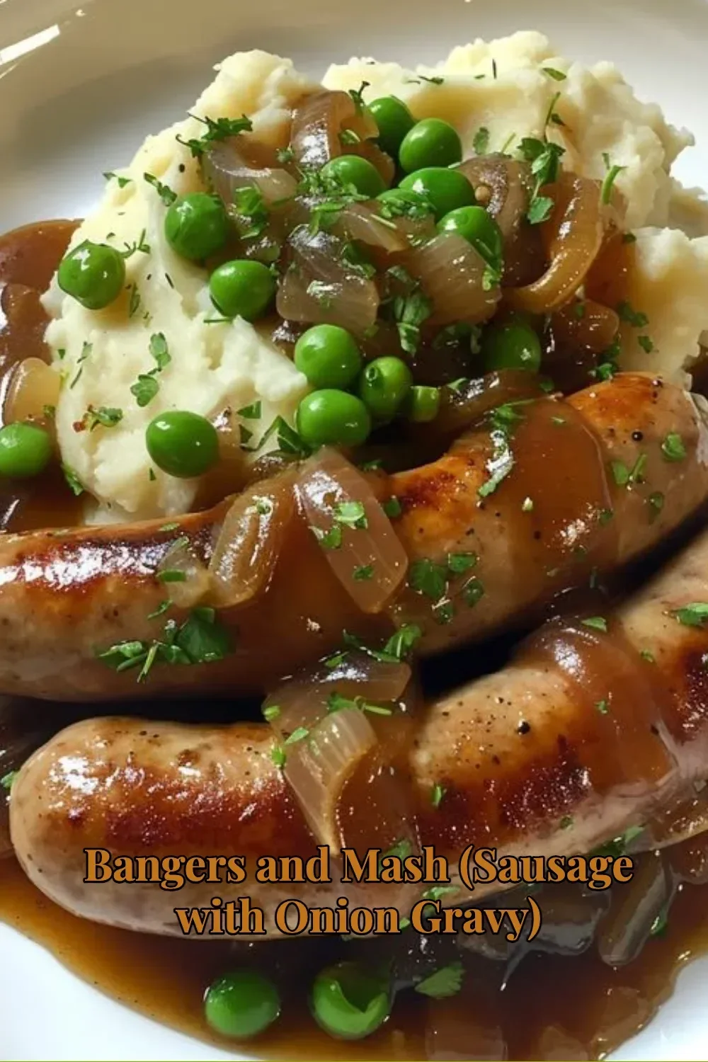 Plate of Bangers and Mash with sausage topped with onion gravy