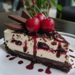 Delicious homemade Black Forest Cheesecake topped with cherries and chocolate shavings.