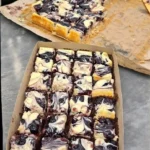 Delicious homemade blueberry cheesecake bars topped with fresh blueberries