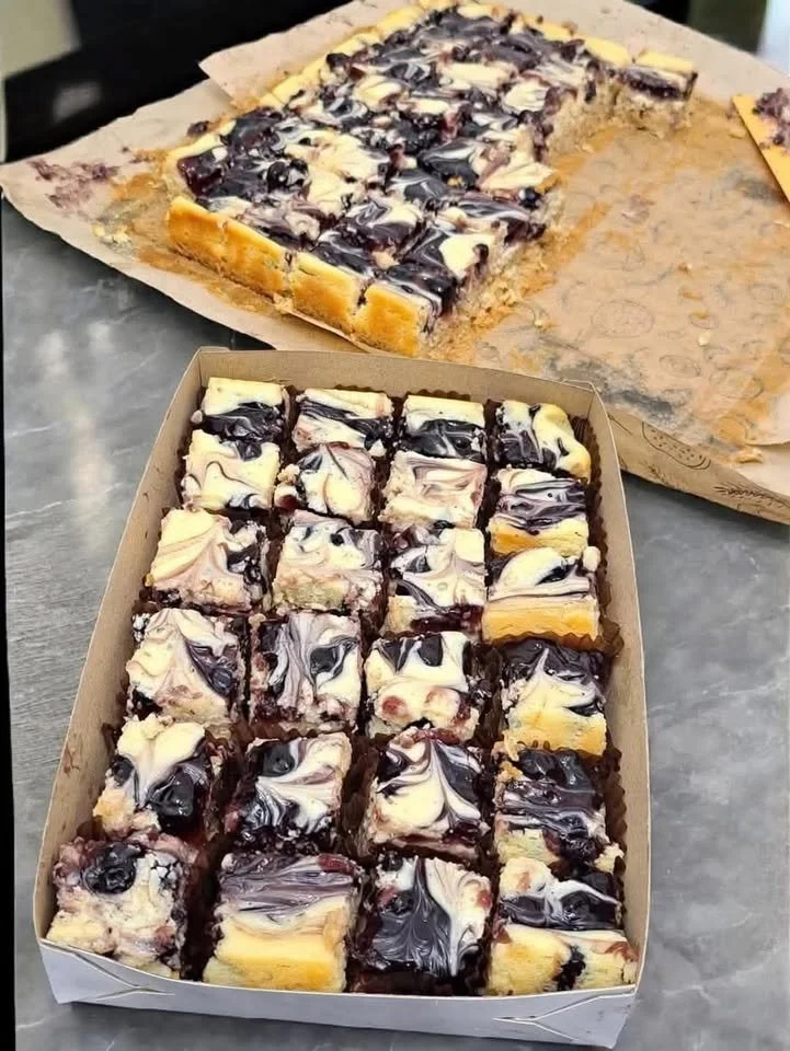 Delicious homemade blueberry cheesecake bars topped with fresh blueberries