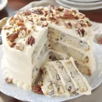 Delicious Butter Pecan Cake topped with pecans and creamy frosting