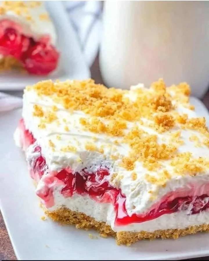 Delicious Cherry Cream Cheese Dessert served in a white bowl.