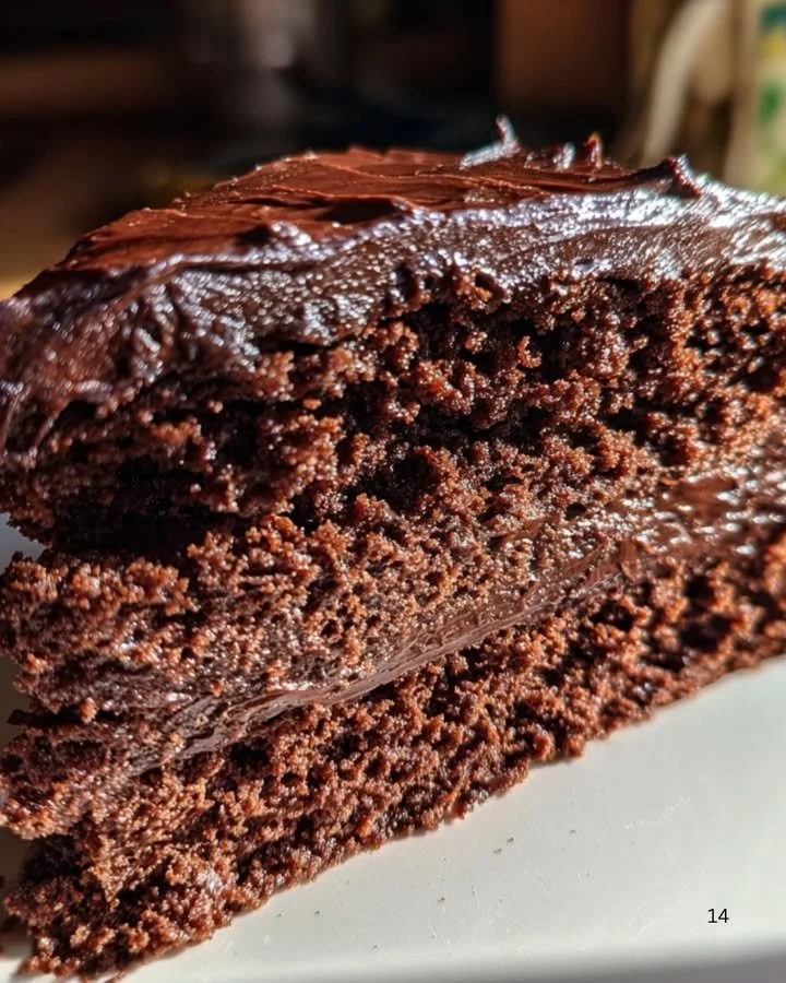 Delicious Chocolate Velvet Cake decorated with ganache and chocolate shavings