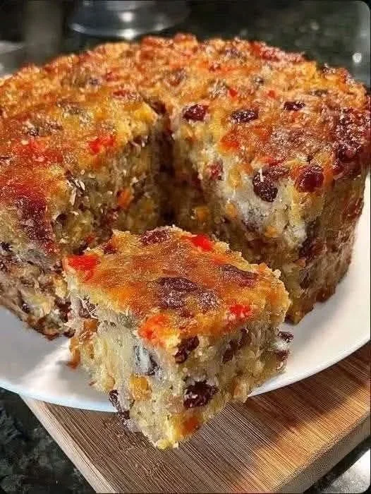 Delicious Christmas fruit cake decorated with dried fruits and nuts