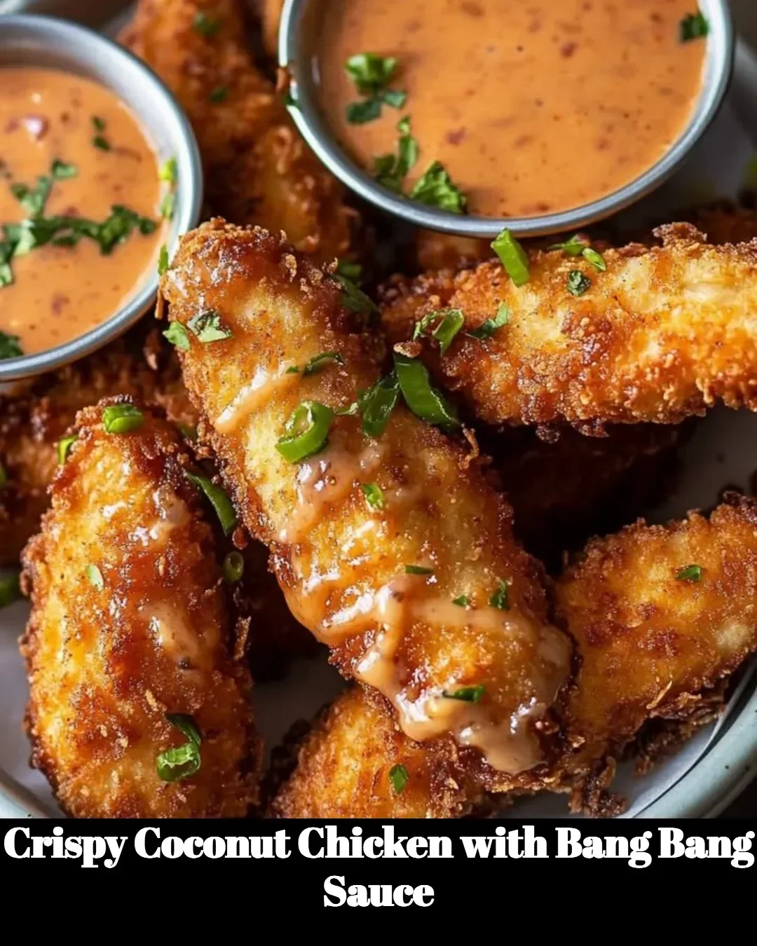 Crispy coconut chicken served with flavorful Bang Bang sauce on a plate.