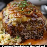 Crockpot French Onion Meatloaf with melted Swiss cheese served on a plate