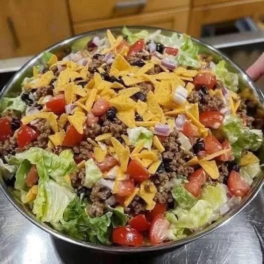 Delicious Dorito Taco Salad with colorful toppings and crunchy Doritos