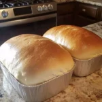 Freshly baked easy homemade bread on a wooden cutting board