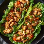 Flavorful teriyaki chicken lettuce wraps served on a plate with garnish
