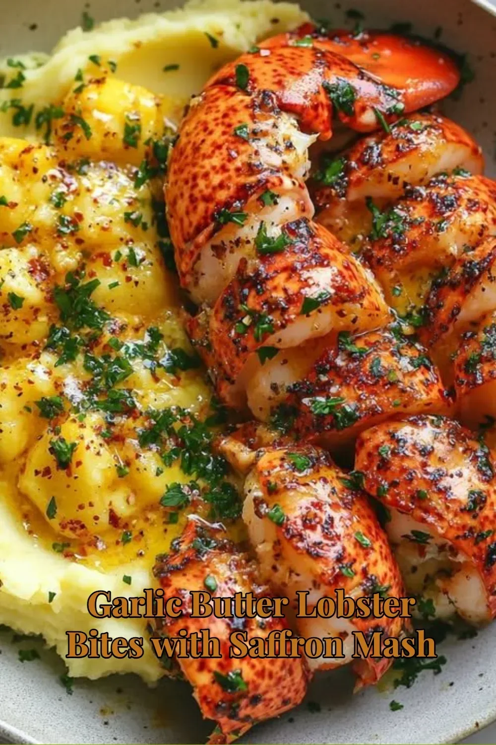 Garlic Butter Lobster Bites served with saffron mash on a plate