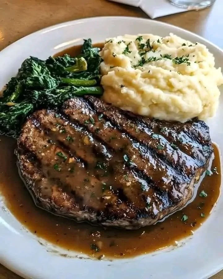 Delicious Garlic Butter Steak served with creamy mashed potatoes on a plate