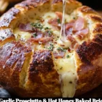 Delicious garlic prosciutto and hot honey baked brie in a bread bowl