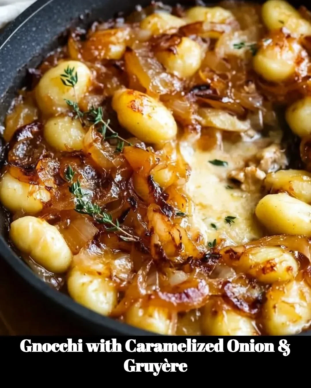 Plate of gnocchi with caramelized onion and Gruyère cheese topping