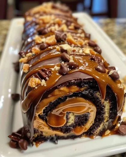 Gooey Chocolate Caramel Turtle Cake Roll with rich chocolate and caramel topping