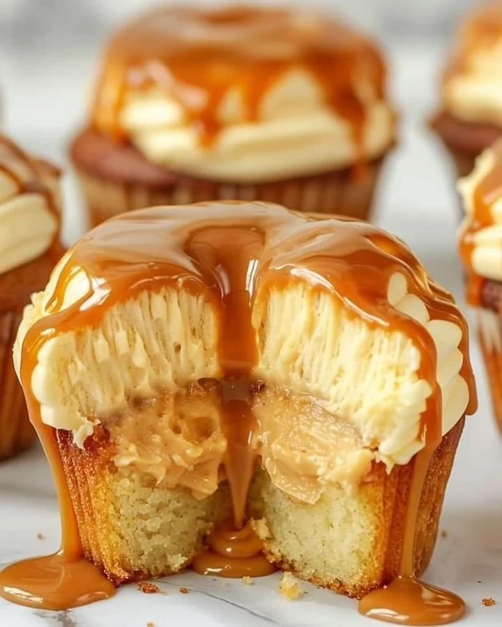 Delicious gooey salted caramel cupcakes topped with creamy frosting
