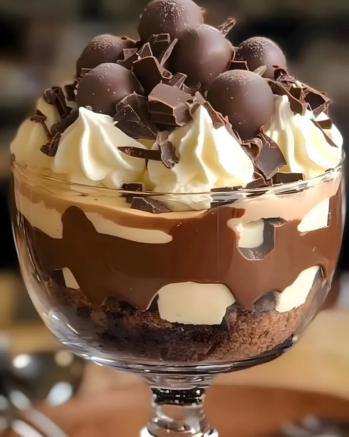 Heavenly Chocolate Cheesecake Trifle in a glass, topped with chocolate shavings
