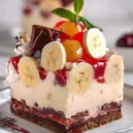 No-bake banana split cheesecake topped with cherries and whipped cream