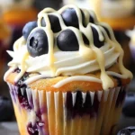 Heavenly White Chocolate Blueberry Cheesecake Cupcakes topped with blueberries