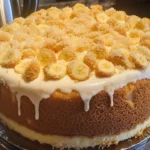 Homemade banana cream cheese pound cake sliced on a white plate