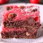 Homemade cherry mash bars topped with chocolate and cherries on a plate