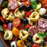 Italian Tortellini Pasta Salad with Salami and Mozzarella served in a bowl.