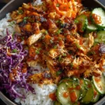 Korean-Style BBQ Chicken Bowl with crunchy cabbage and sesame toppings