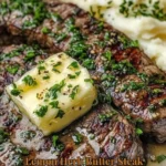 Lemon Herb Butter Steak served with fluffy mashed potatoes on a plate.