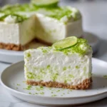 Delicious Lime Mousse Cheesecake topped with lime zest and whipped cream