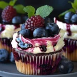 Luxurious white chocolate blueberry cheesecake cupcakes on a decorative plate
