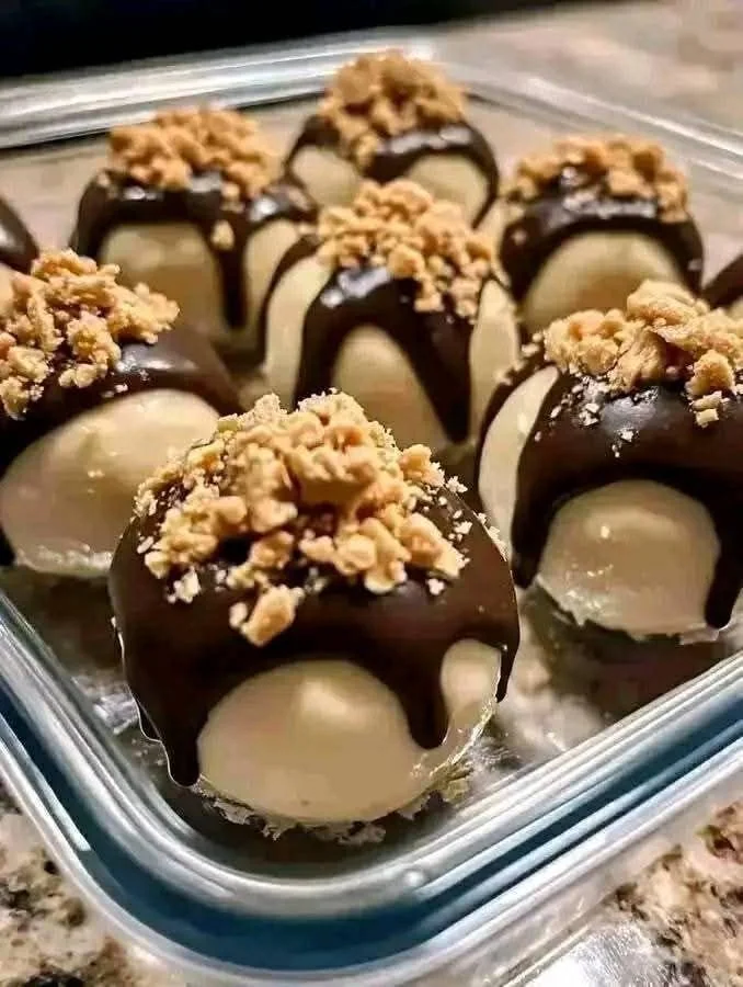 No-Bake Peanut Butter Cheesecake Balls garnished with chocolate drizzle
