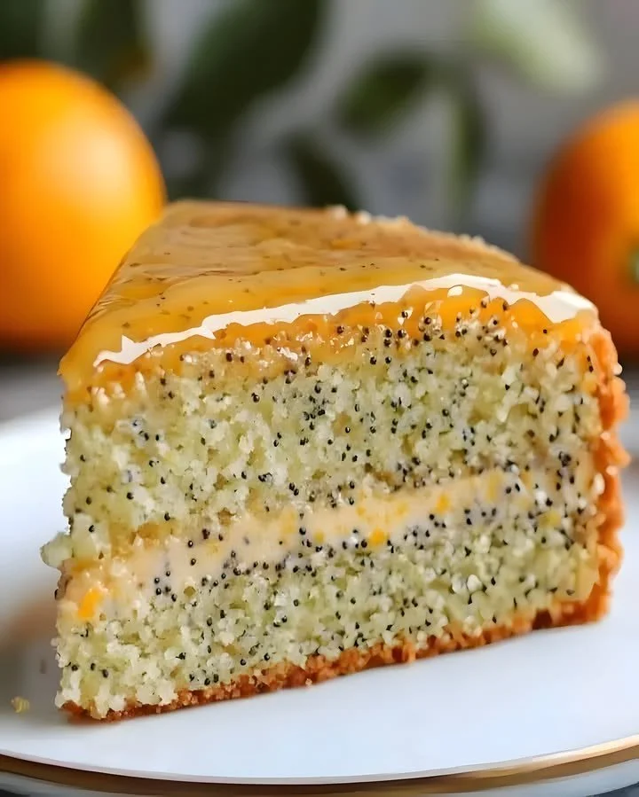 Orange Poppy Seed Cake with Citrus Glaze served on a plate