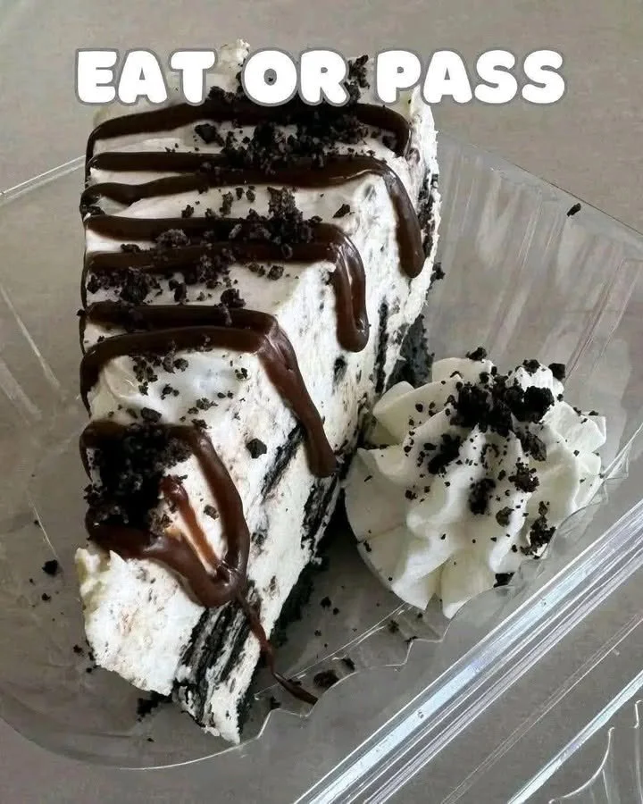 Delicious homemade Oreo Cheesecake garnished with Oreo cookies and whipped cream