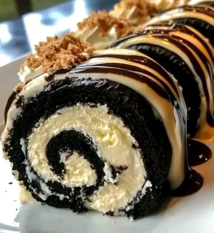 Oreo Cream Cheese Cheesecake Sushi Roll garnished with chocolate drizzle