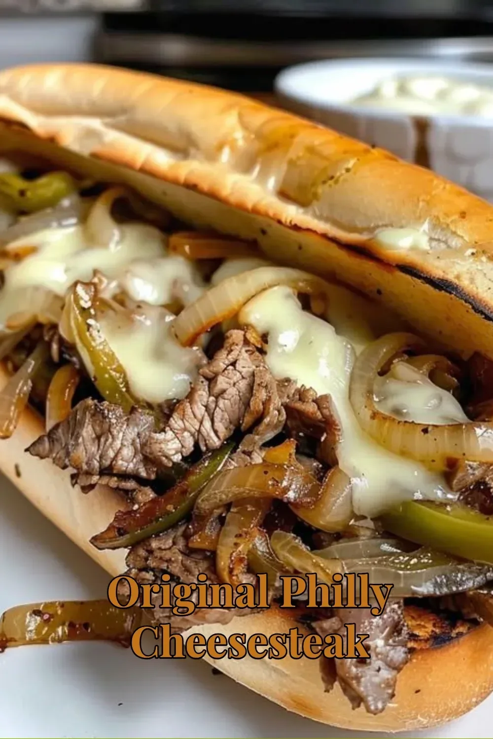 Delicious Original Philly Cheesesteak with melted cheese and grilled steak on a hoagie roll