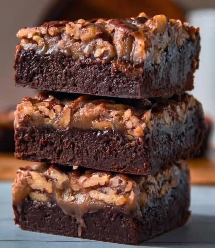 Delicious pecan and caramel brownies served on a plate