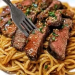 Pineapple fried chicken wings garnished with herbs and pineapple slices.