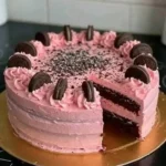 Delicious Pink Oreo Cake decorated with cream and Oreo crumbs