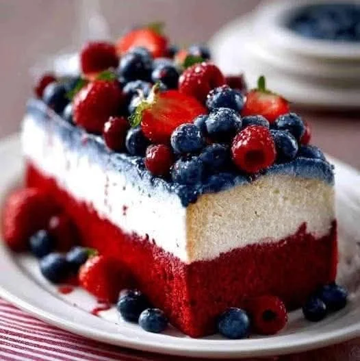 Red, White & Blue Poke Cake decorated for a festive celebration.